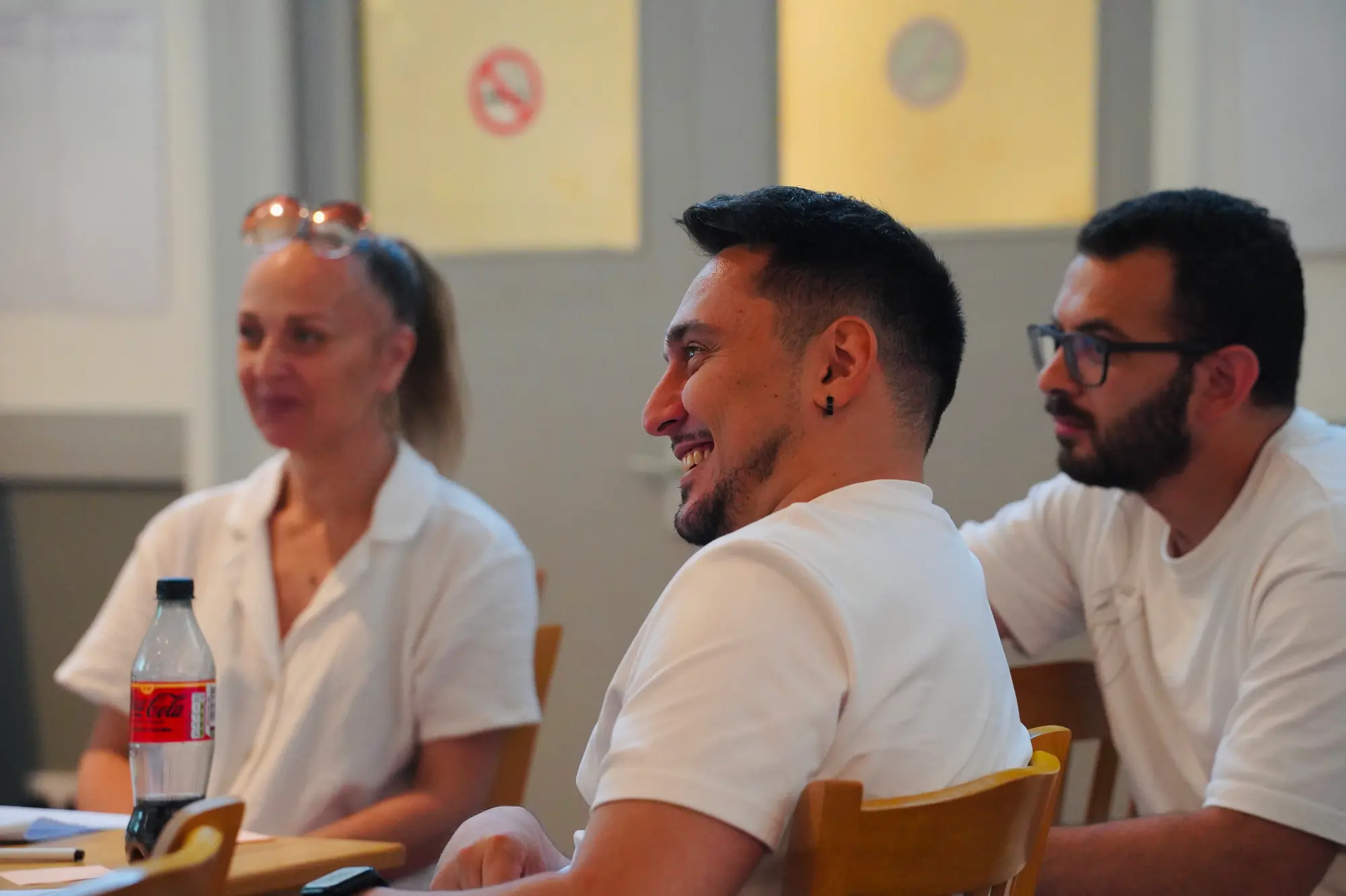 A workshop participant laughing during a group discussion